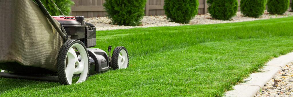 Freshly mowed green lawn in front of a suburban home in Springfield, MO, representing professional lawn care services by Gabris Landscaping